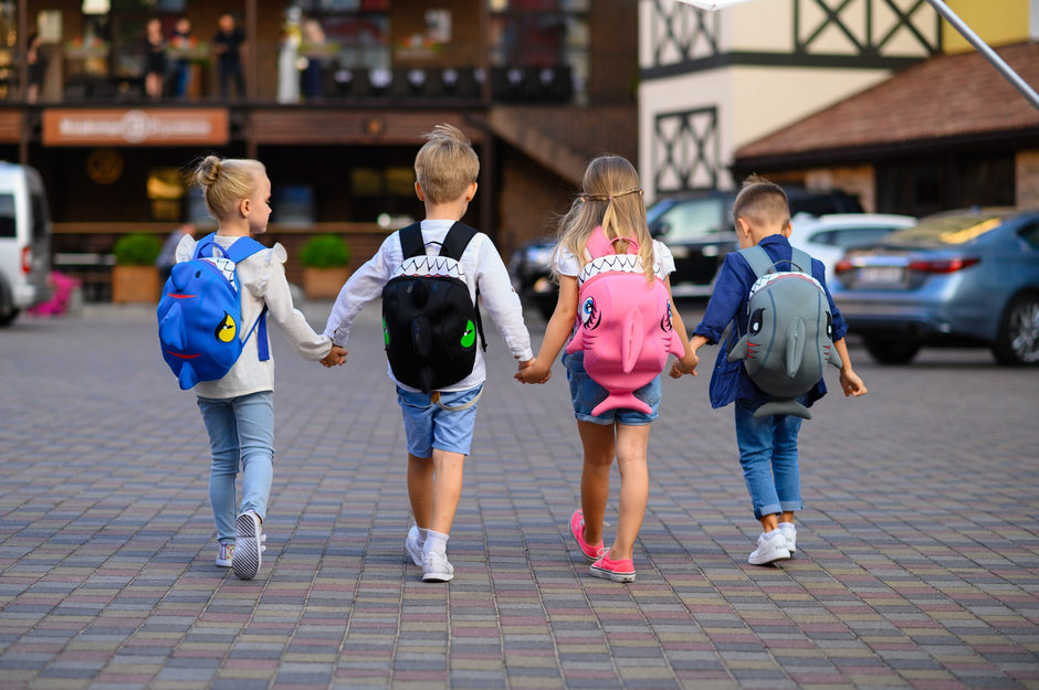 Four kids with Crazy Safety backpacks